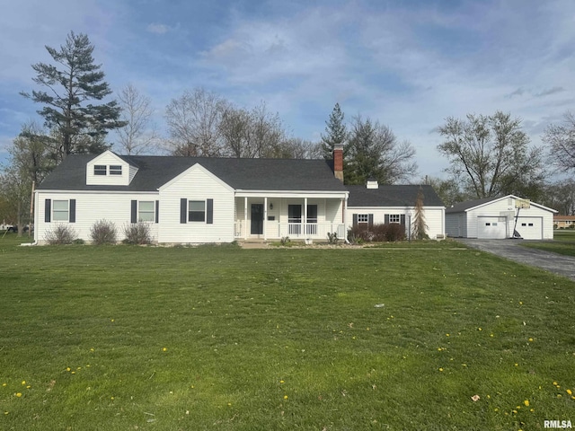 912 N Main St, Monroe City, MO 63456 - view of front facade featuring a porch, a chimney, a front yard, and a detached garage