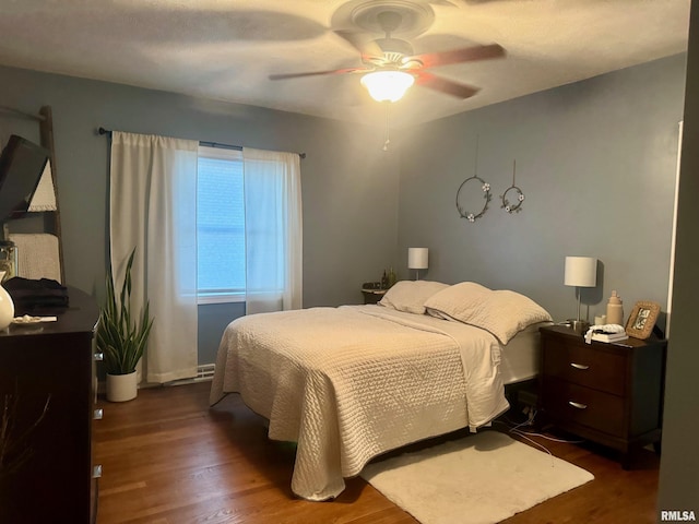 912 N Main St, Monroe City, MO 63456 - bedroom featuring a ceiling fan and wood finished floors