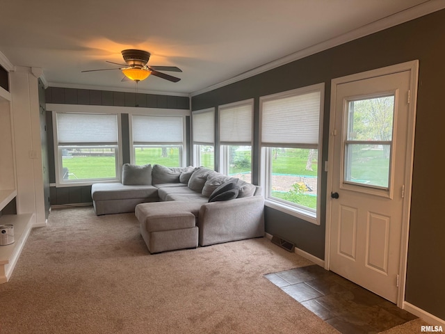 912 N Main St, Monroe City, MO 63456 - carpeted living room with crown molding, baseboards, ceiling fan, and visible vents