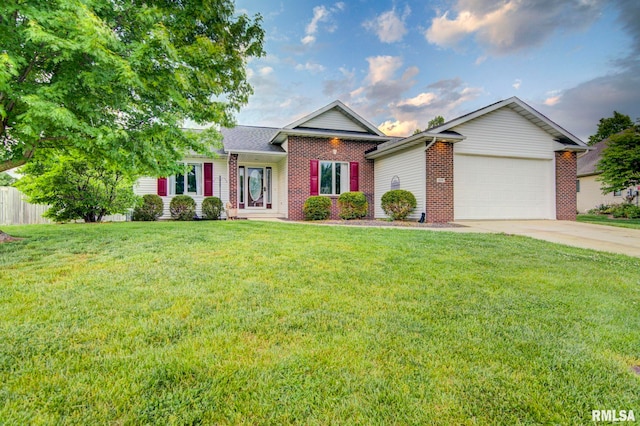 single story home featuring brick siding, a garage, and driveway