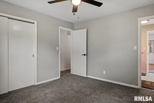 unfurnished bedroom with carpet flooring, a ceiling fan, baseboards, visible vents, and a closet