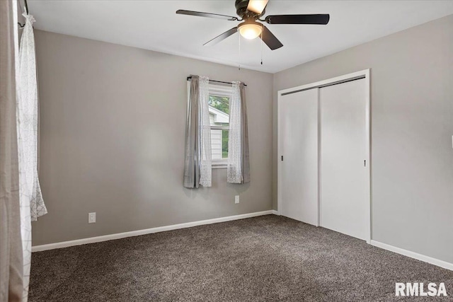 unfurnished bedroom with carpet floors, baseboards, ceiling fan, and a closet