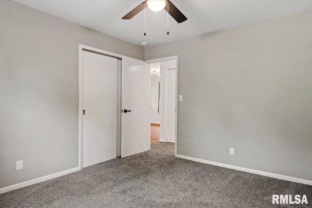 unfurnished bedroom with baseboards, a ceiling fan, and carpet