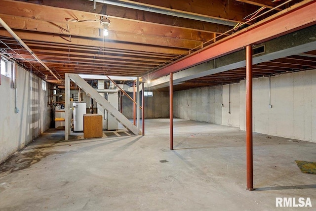 unfinished basement with gas water heater