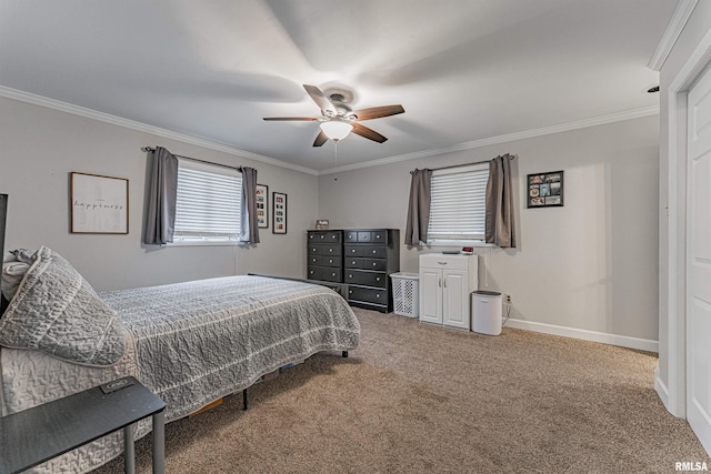 carpeted bedroom featuring baseboards, ornamental molding, and a ceiling fan