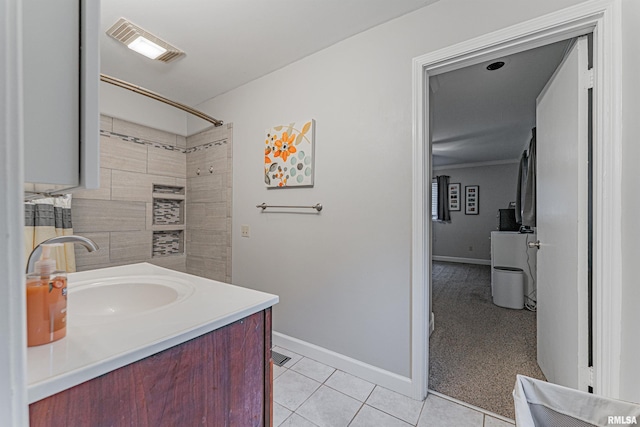 bathroom with baseboards, vanity, tile patterned floors, and visible vents