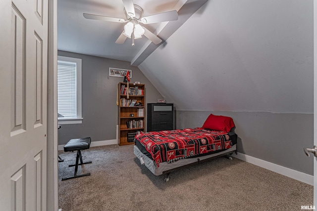 bedroom with carpet flooring, ceiling fan, baseboards, and lofted ceiling