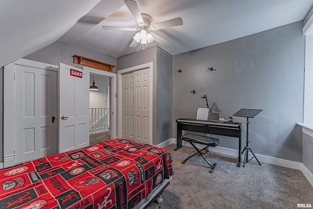 bedroom with carpet flooring, a ceiling fan, baseboards, vaulted ceiling, and a closet