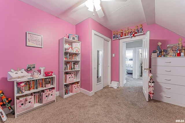 playroom featuring carpet floors, baseboards, ceiling fan, and lofted ceiling