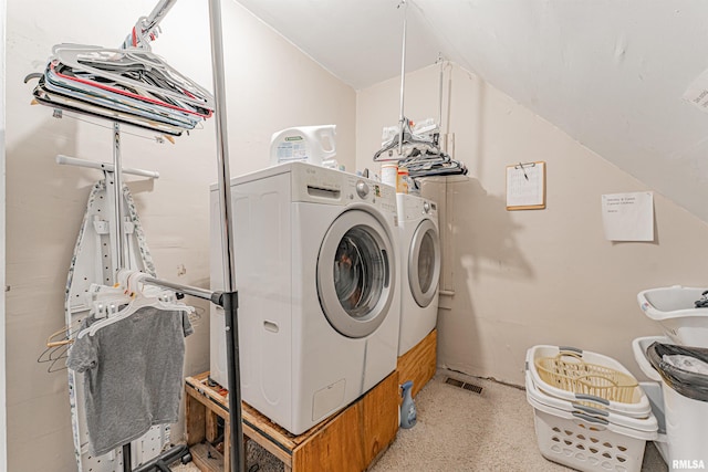 washroom with independent washer and dryer and laundry area