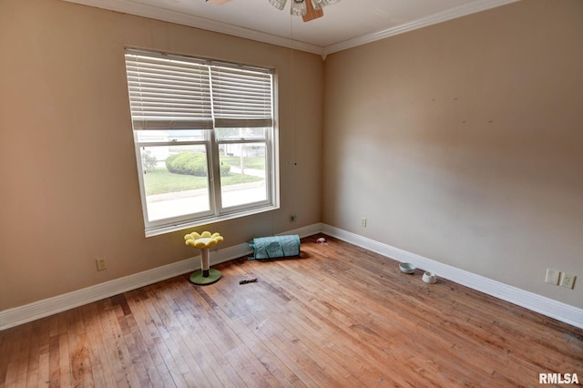 629 W Adams St, Taylorville, IL 62568 - unfurnished room featuring baseboards, ceiling fan, crown molding, and hardwood / wood-style flooring
