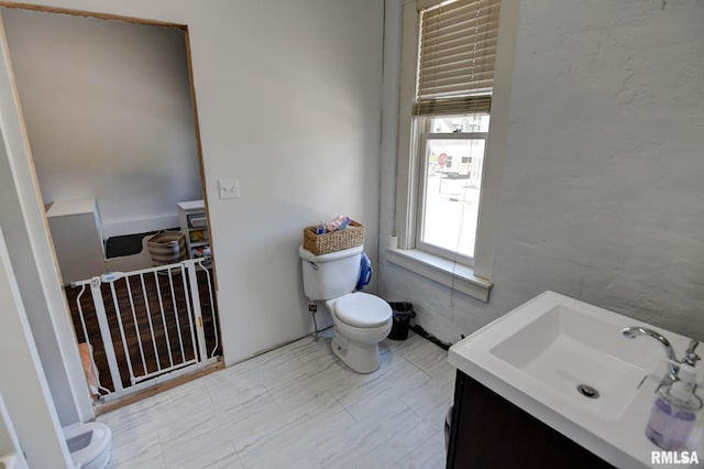 629 W Adams St, Taylorville, IL 62568 - bathroom with toilet and vanity