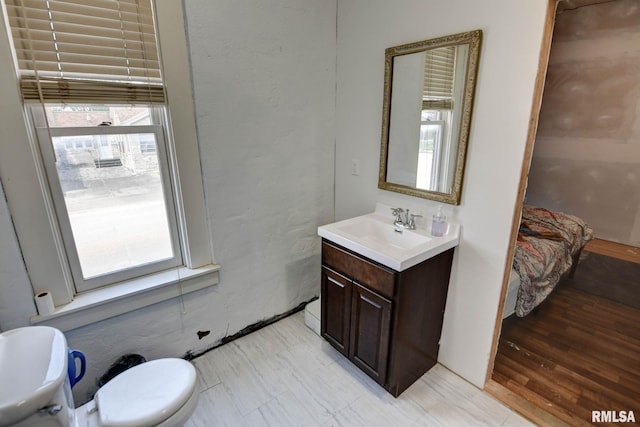 629 W Adams St, Taylorville, IL 62568 - bathroom featuring vanity and toilet