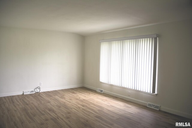24 Parkway Dr, Sherman, IL 62684 - empty room with wood finished floors and baseboards
