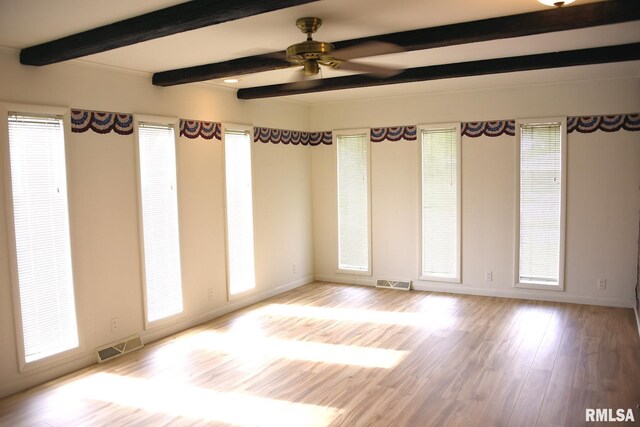 24 Parkway Dr, Sherman, IL 62684 - unfurnished room with beam ceiling, baseboards, wood finished floors, and a ceiling fan