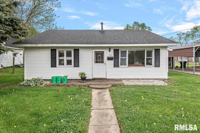 1106 E Jefferson St, Clinton, IL 61727 - view of front of property with a front yard and roof with shingles