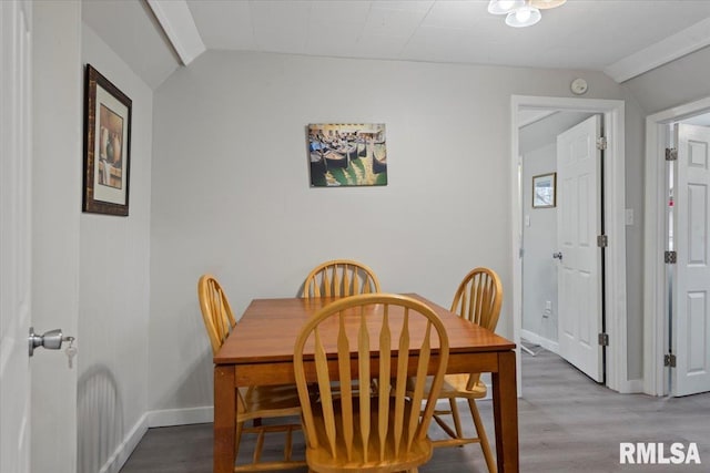 1127 N 6th St, Springfield, IL 62702 - dining space featuring baseboards, wood finished floors, and lofted ceiling