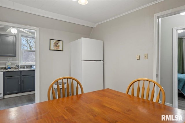 1127 N 6th St, Springfield, IL 62702 - dining space with ceiling fan, ornamental molding, and wood finished floors