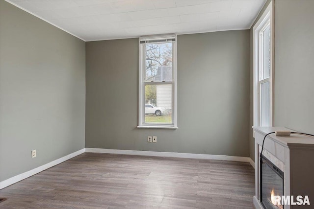 1127 N 6th St, Springfield, IL 62702 - unfurnished room with crown molding, baseboards, wood finished floors, and visible vents