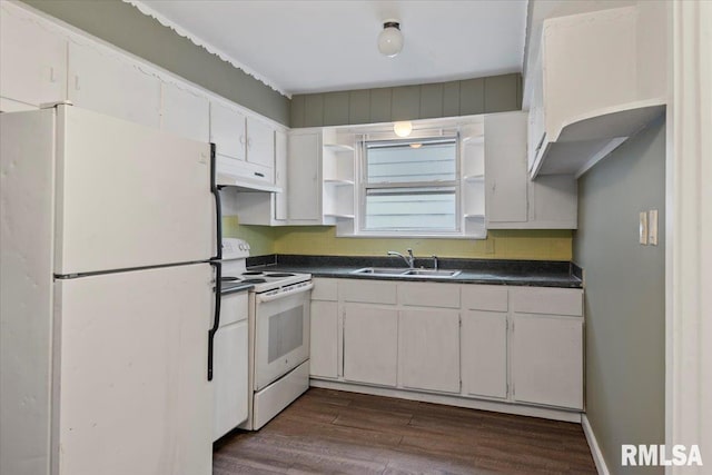 1127 N 6th St, Springfield, IL 62702 - kitchen with dark countertops, white appliances, under cabinet range hood, a sink, and dark wood finished floors