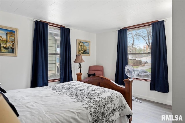 1127 N 6th St, Springfield, IL 62702 - bedroom featuring baseboards and wood finished floors