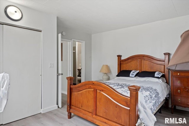 1127 N 6th St, Springfield, IL 62702 - bedroom with light wood-style floors and a closet