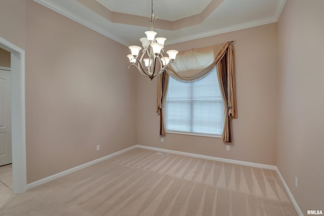 3408 Wynvalley Rd, Quincy, IL 62301 - empty room featuring a chandelier, light carpet, baseboards, crown molding, and a tray ceiling