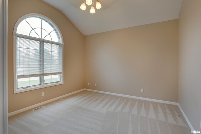 3408 Wynvalley Rd, Quincy, IL 62301 - unfurnished room with light colored carpet, vaulted ceiling, and baseboards