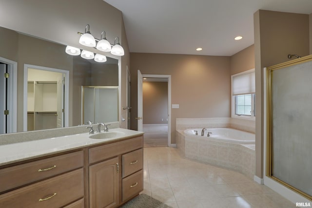 3408 Wynvalley Rd, Quincy, IL 62301 - full bath featuring a shower stall, tile patterned flooring, a bath, vanity, and a spacious closet
