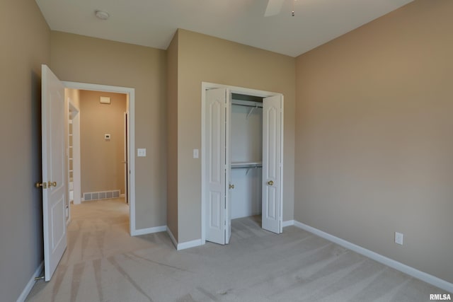 3408 Wynvalley Rd, Quincy, IL 62301 - unfurnished bedroom with light carpet, a closet, baseboards, and ceiling fan