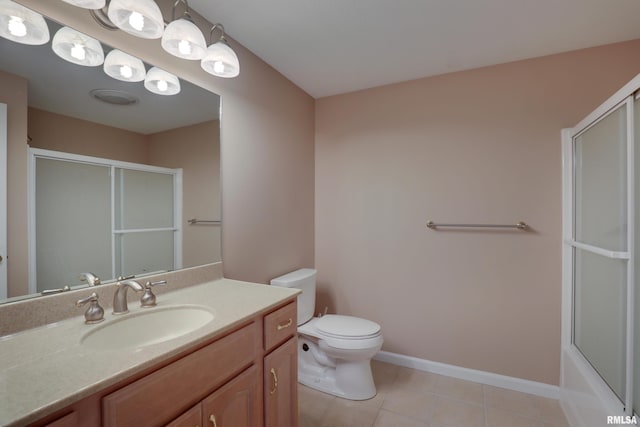3408 Wynvalley Rd, Quincy, IL 62301 - bathroom with an enclosed shower, toilet, tile patterned floors, vanity, and baseboards