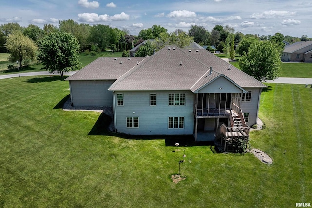 3408 Wynvalley Rd, Quincy, IL 62301 - back of property featuring a sunroom, a lawn, a shingled roof, and stairway