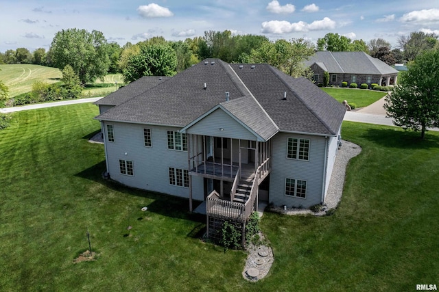 3408 Wynvalley Rd, Quincy, IL 62301 - rear view of property featuring roof with shingles, a sunroom, a yard, and stairs