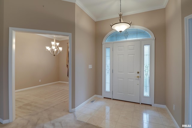 3408 Wynvalley Rd, Quincy, IL 62301 - foyer entrance featuring ornamental molding, a chandelier, and baseboards