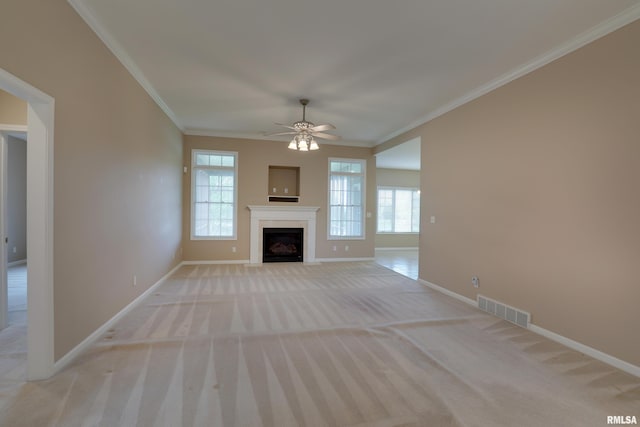 3408 Wynvalley Rd, Quincy, IL 62301 - unfurnished living room featuring baseboards, light carpet, healthy amount of natural light, crown molding, and a fireplace with flush hearth