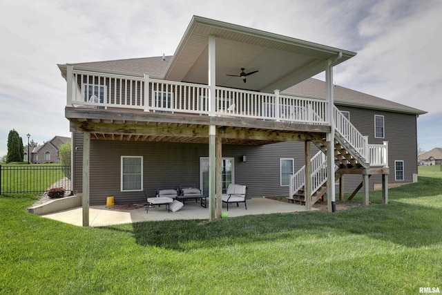 back of house with a patio area, a wooden deck, roof with shingles, ceiling fan, and outdoor lounge area