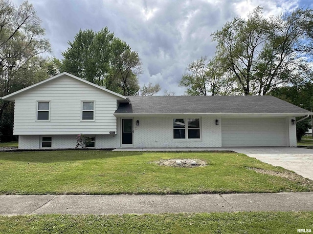 1815 Stonehenge Rd, Springfield, IL 62702 - tri-level home with an attached garage, concrete driveway, a front yard, and brick siding