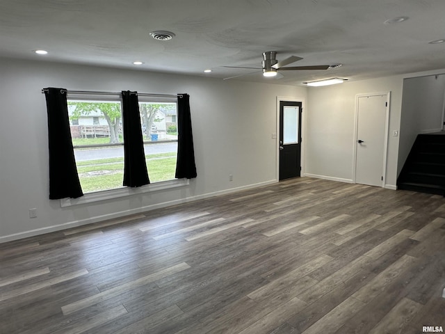 1815 Stonehenge Rd, Springfield, IL 62702 - empty room featuring dark wood-style floors, a ceiling fan, stairs, and recessed lighting