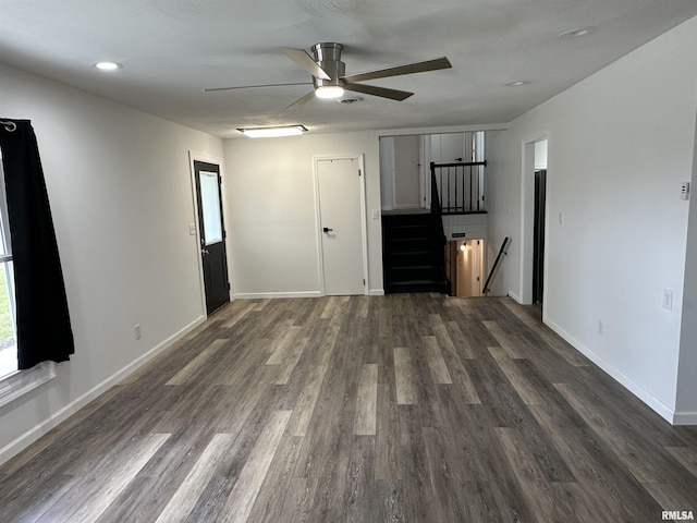 1815 Stonehenge Rd, Springfield, IL 62702 - unfurnished living room featuring a ceiling fan, dark wood finished floors, and recessed lighting