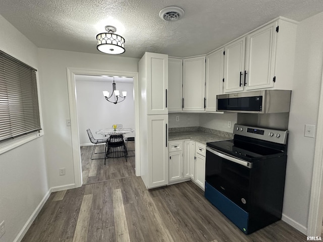1815 Stonehenge Rd, Springfield, IL 62702 - kitchen featuring range with electric stovetop, stainless steel microwave, dark wood-type flooring, white cabinetry, and a textured ceiling