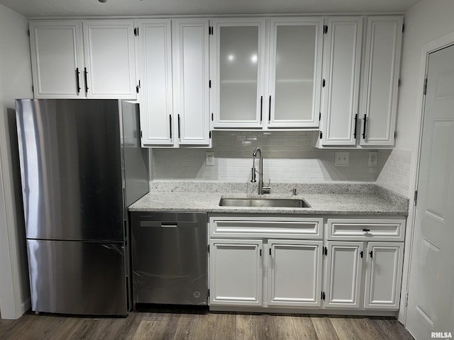 1815 Stonehenge Rd, Springfield, IL 62702 - kitchen with stainless steel appliances, white cabinetry, light stone counters, and decorative backsplash