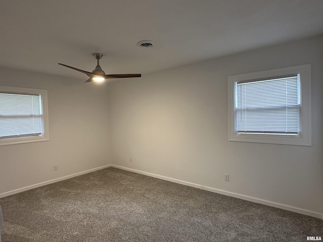 1815 Stonehenge Rd, Springfield, IL 62702 - spare room with dark carpet and ceiling fan