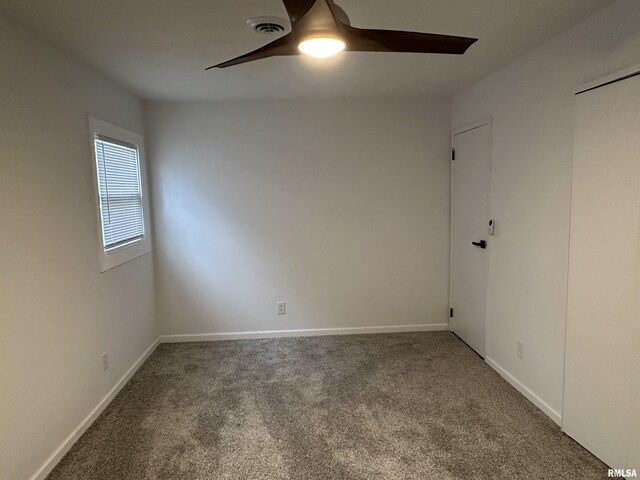 1815 Stonehenge Rd, Springfield, IL 62702 - carpeted spare room featuring a ceiling fan and baseboards