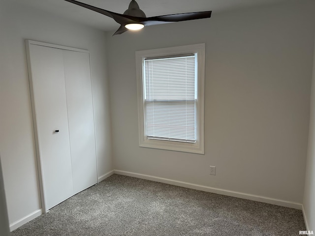 1815 Stonehenge Rd, Springfield, IL 62702 - unfurnished bedroom featuring carpet, a closet, and ceiling fan