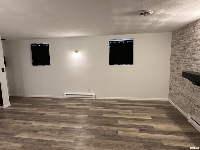 1815 Stonehenge Rd, Springfield, IL 62702 - unfurnished living room with a baseboard heating unit, wood finished floors, and baseboard heating