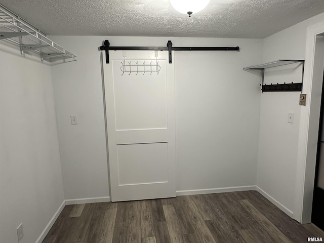 1815 Stonehenge Rd, Springfield, IL 62702 - walk in closet with a barn door and wood finished floors
