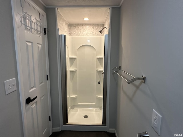 1815 Stonehenge Rd, Springfield, IL 62702 - bathroom with a stall shower and baseboards