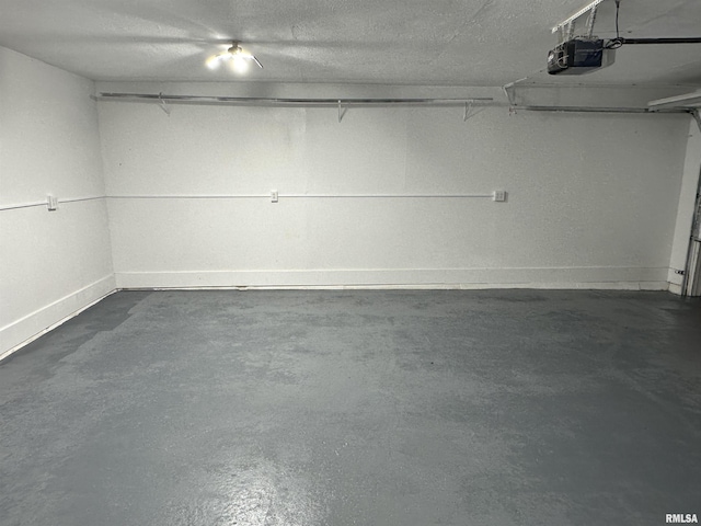 1815 Stonehenge Rd, Springfield, IL 62702 - garage featuring baseboards and a garage door opener