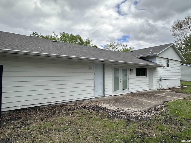 1815 Stonehenge Rd, Springfield, IL 62702 - rear view of house with a patio, french doors, and roof with shingles