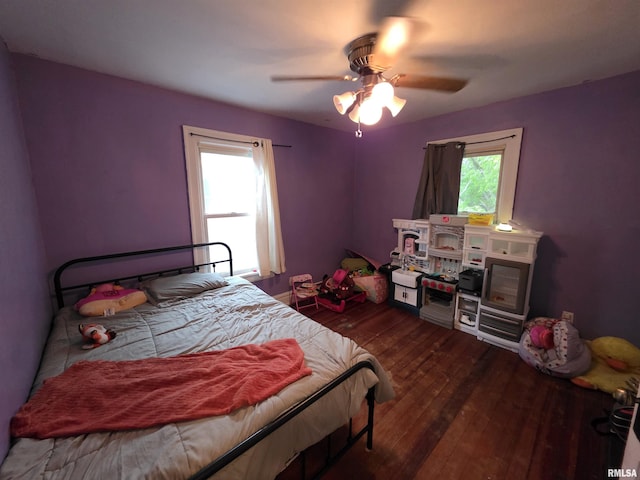 bedroom featuring wood-type flooring and ceiling fan